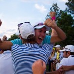Carlota Ciganda celebrates with team mates after Karin Icher holes a putt on the 18th green to give Europe a 10.5 -5.5 lead heading into the Sunday singles matches